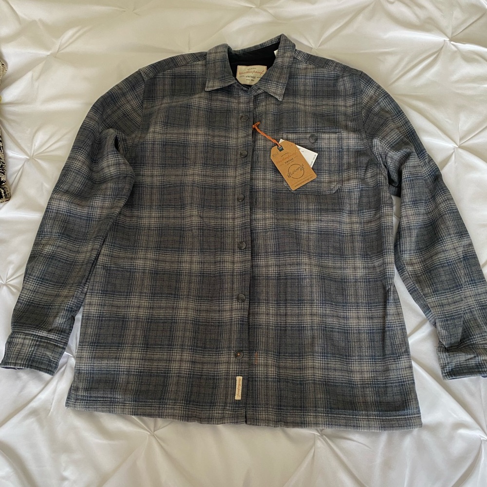 Women’s lined flannel jacket. Size L with pockets.